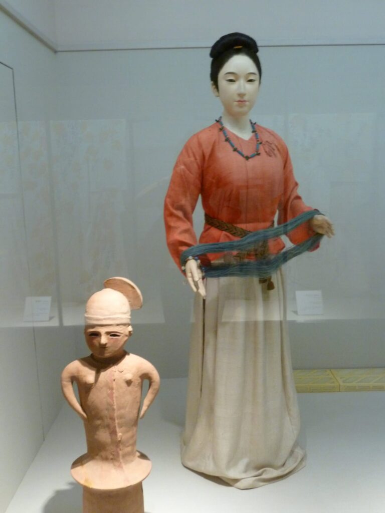 Lady of the period with haniwa terracotta figure showing clothing and hairstyle